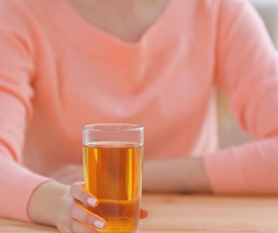 Young beautiful  woman with glass of juice
